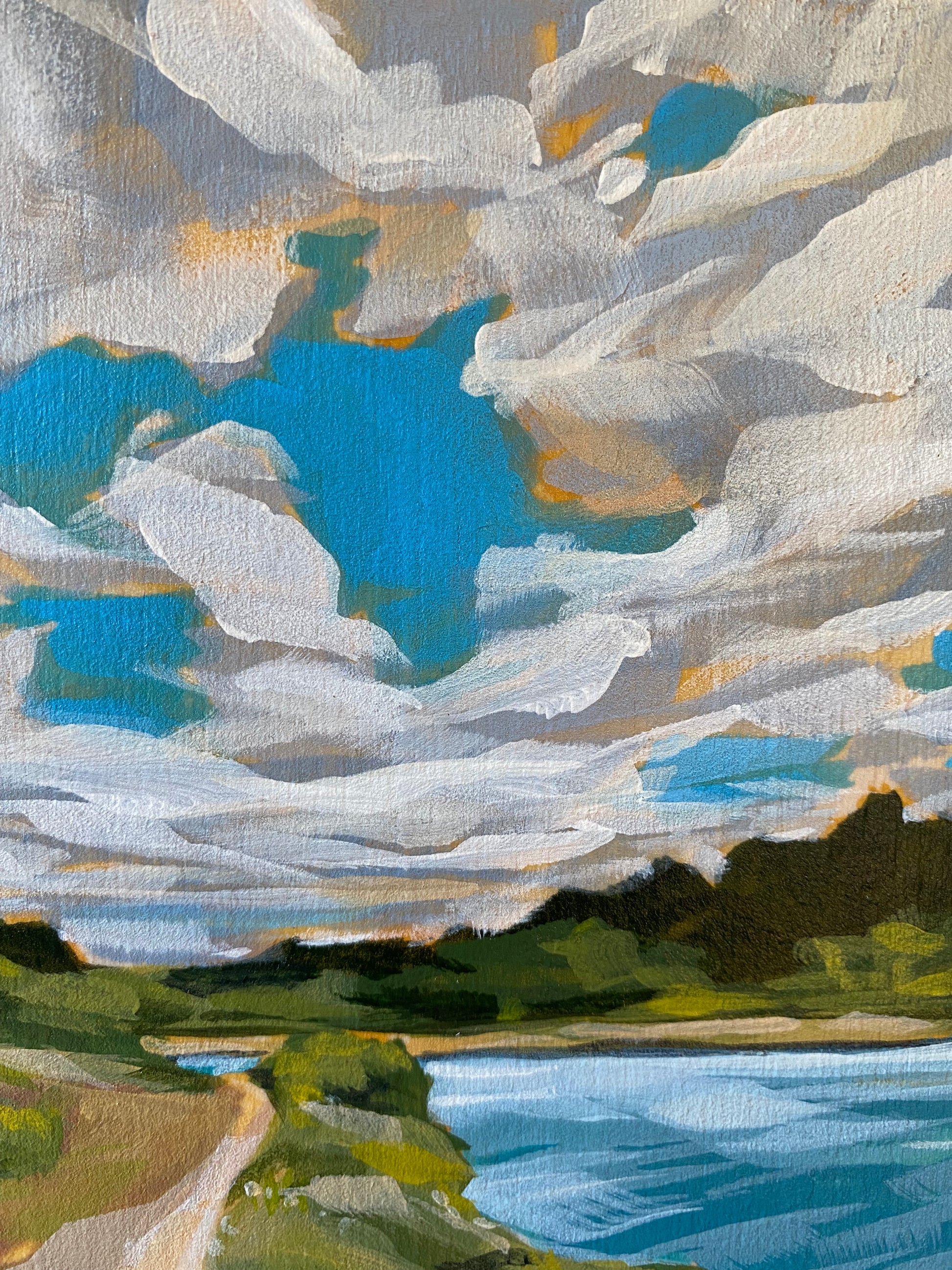 Close up of 5x7 acrylic painting for sale of a trail . Features bright blues with a cloudy sky and lush green trees.
