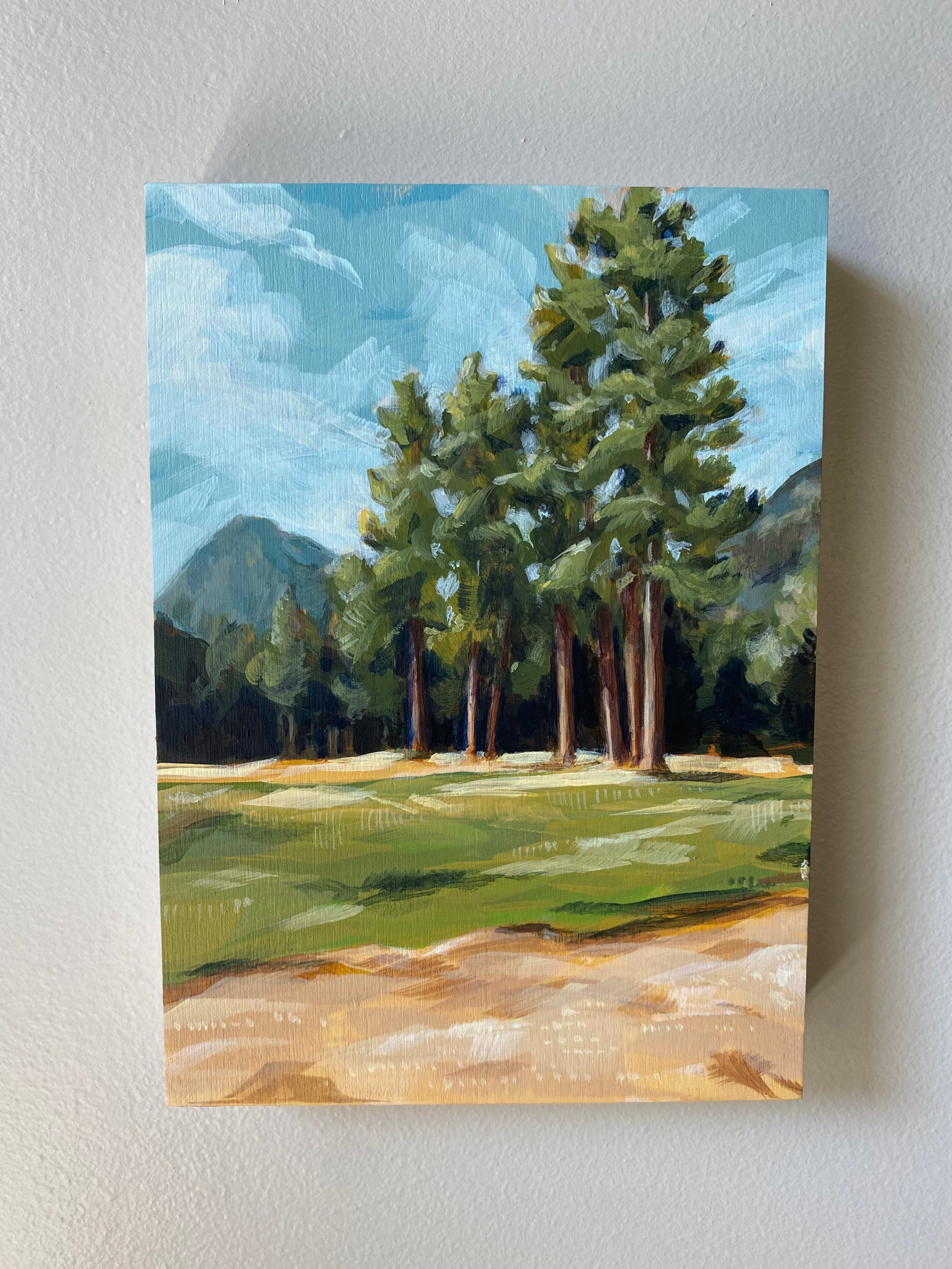 5x7 original acrylic art painting of joseph mountains. The nature landscape scene features tall trees and a mountain scape.